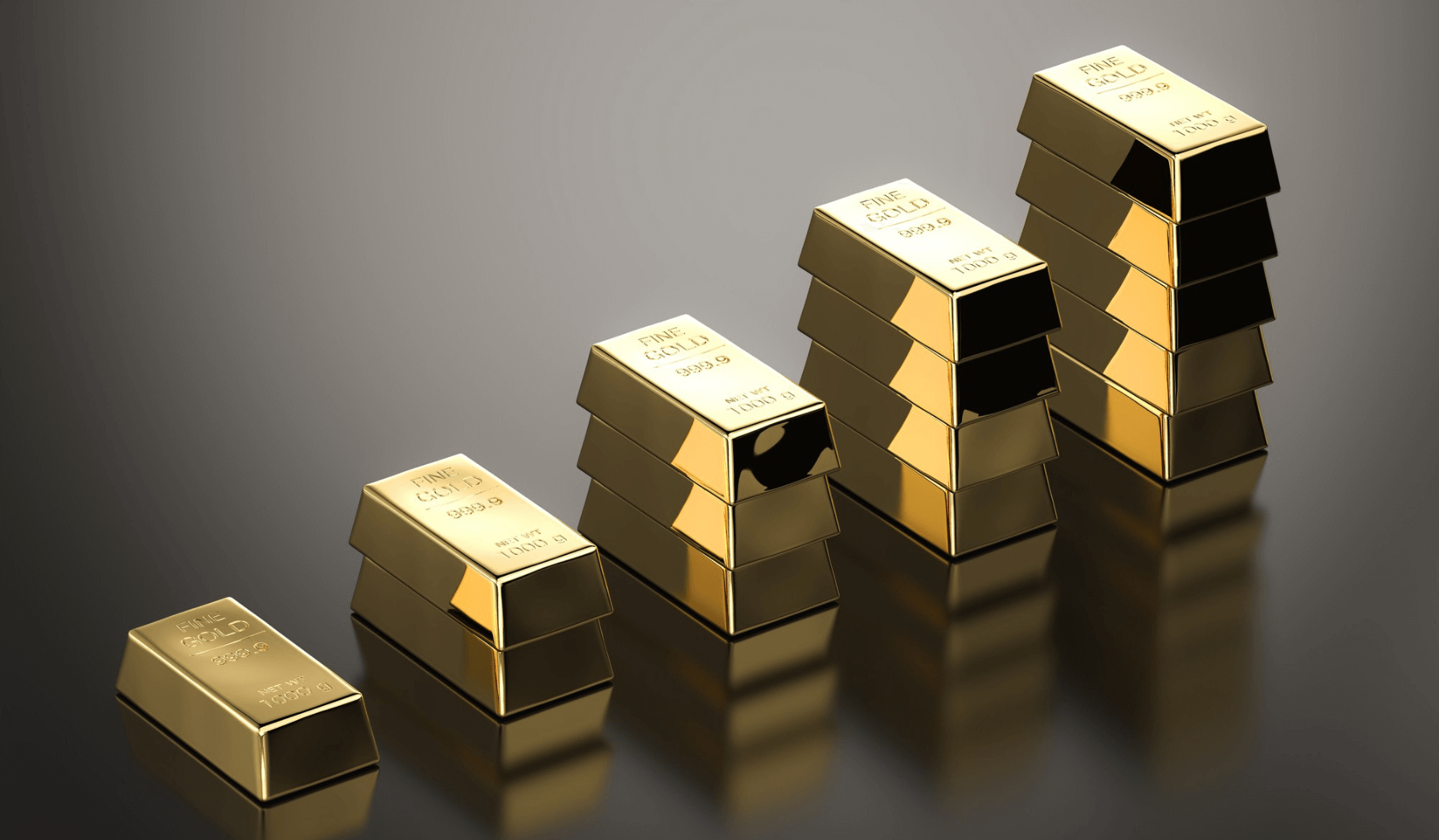 Stosy złotych sztabek symbolizujące wzrost wartości złota